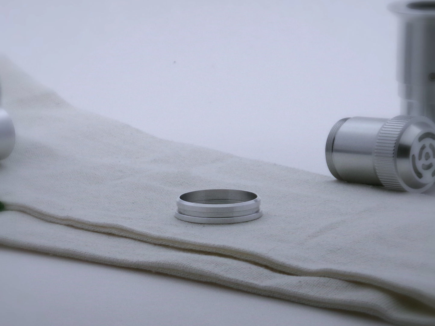 Single aluminum accent ring for VHC lightsabers with offset bands and a deep central groove, beveled lower edge facing upward.