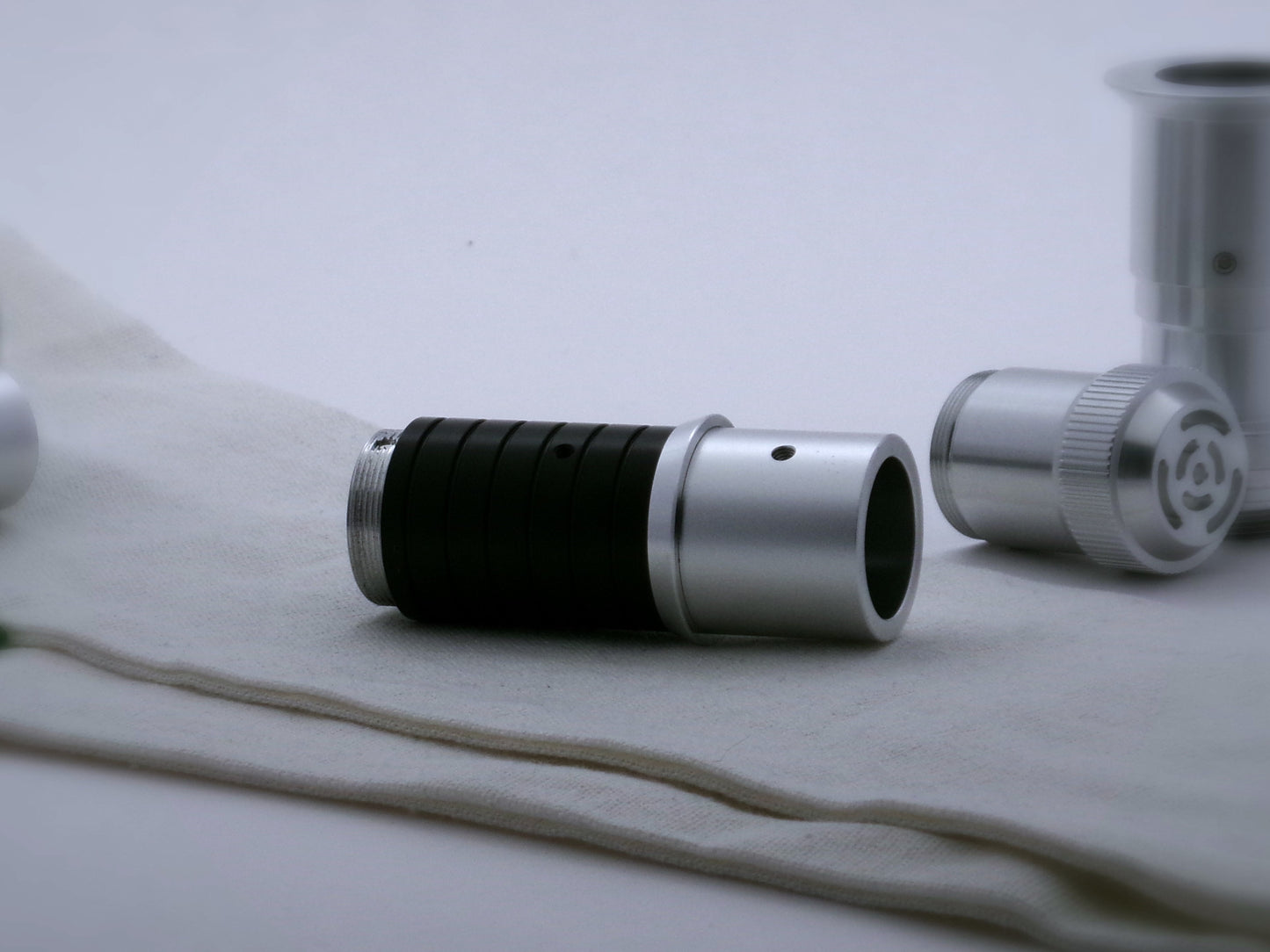 Single, beveled aluminum accent ring installed on a mixed selection of VHC lightsaber components.