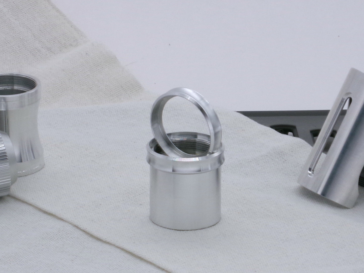Pair of VHC compatible, aluminum lightsaber accent rings, installed and displayed on a lightsaber body segment.