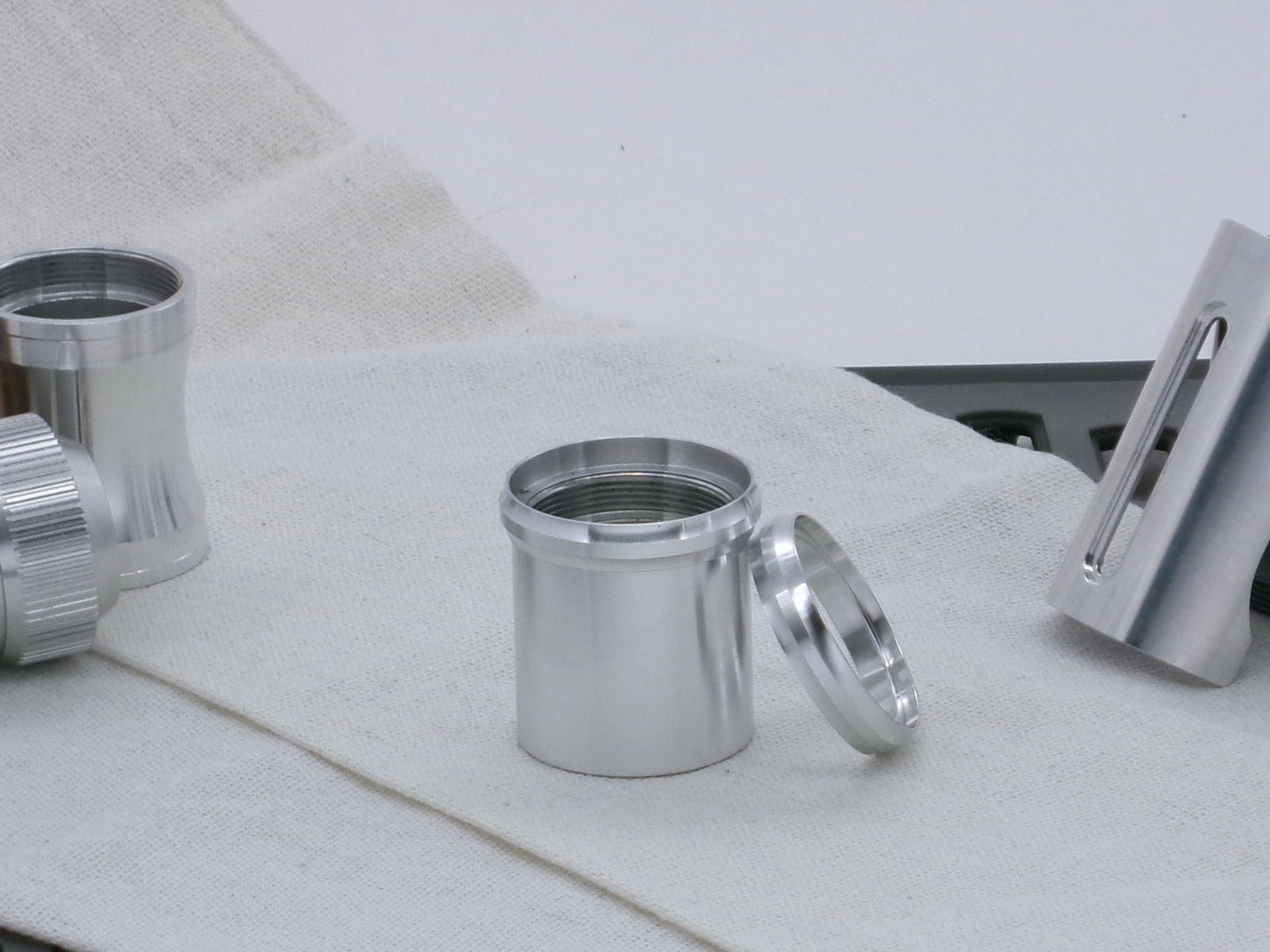 Pair of VHC compatible, aluminum lightsaber accent rings, one installed on a lightsaber body segment, the other askew.