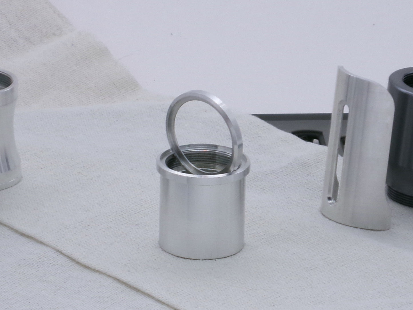 Pair of VHC compatible, aluminum lightsaber accent rings, one installed on a lightsaber body segment, the other displayed.