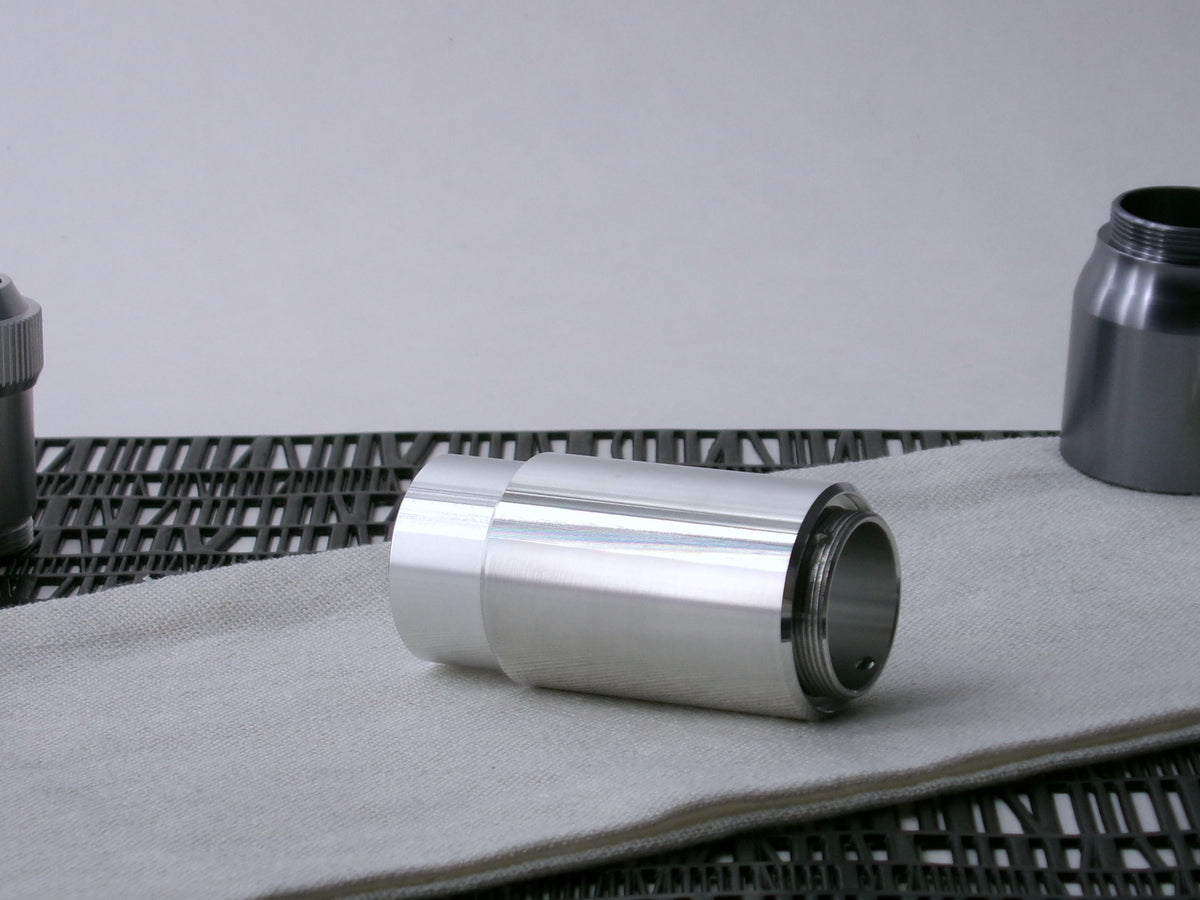 A beveled, VHC-compatible, lightsaber Accent Sleeve sits 3/4 view installed on a CSF Body Segment.