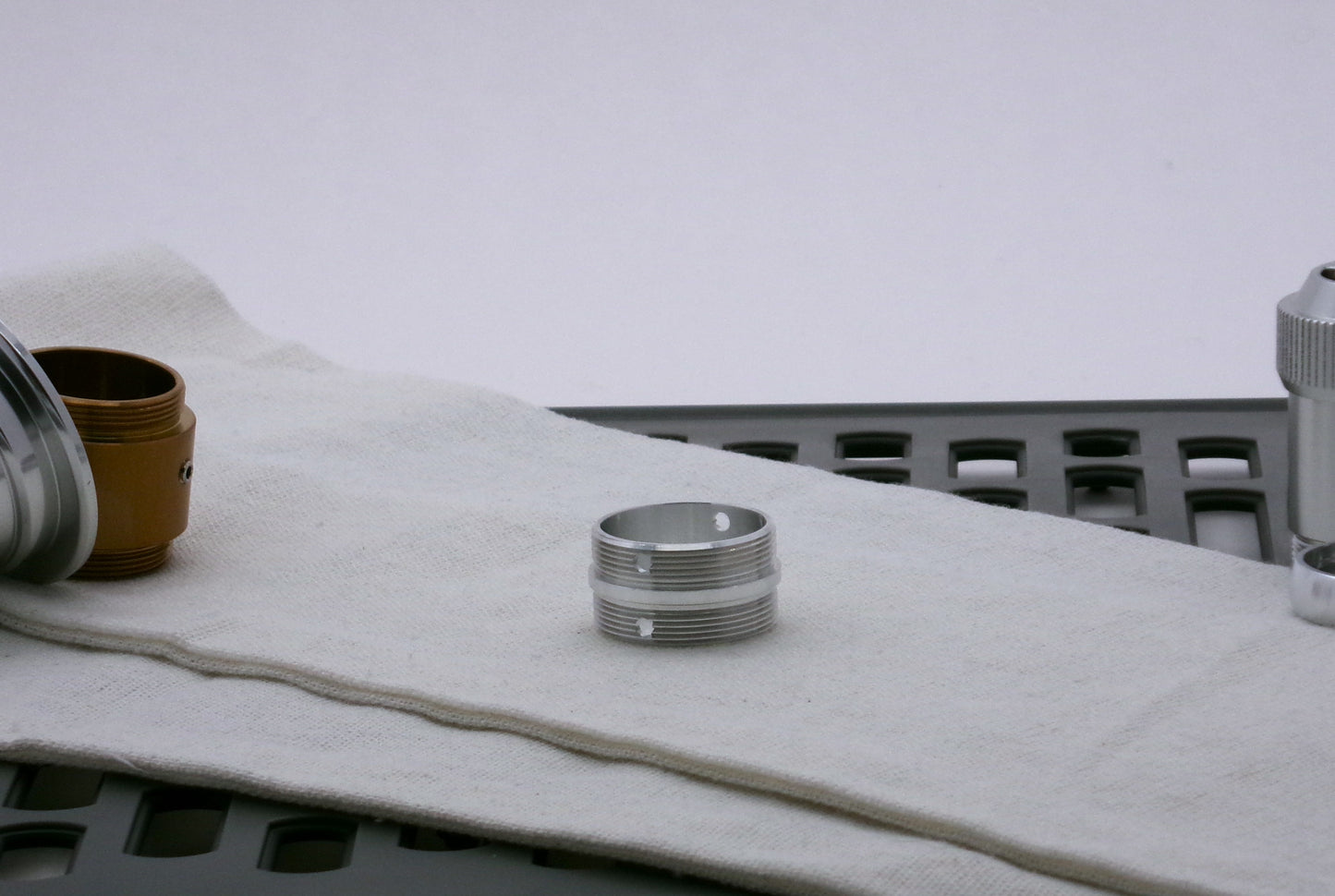 Single, aluminum male/male threaded adapter for VHC lightsabers; 30mm diameter.