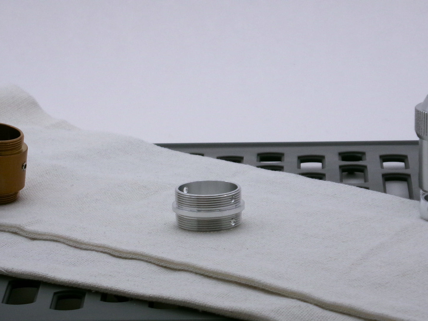 Single aluminum male/male threaded adapter for VHC lightsabers; 31.5mm diameter.