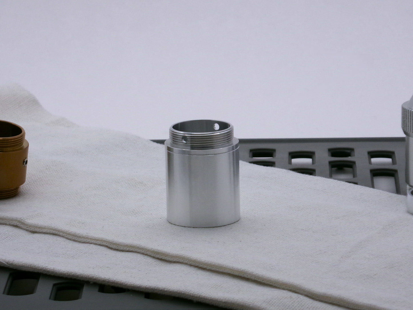 Single, aluminum male/male threaded adapter for VHC lightsabers installed in a Type_2 Body Component; 33mm diameter.