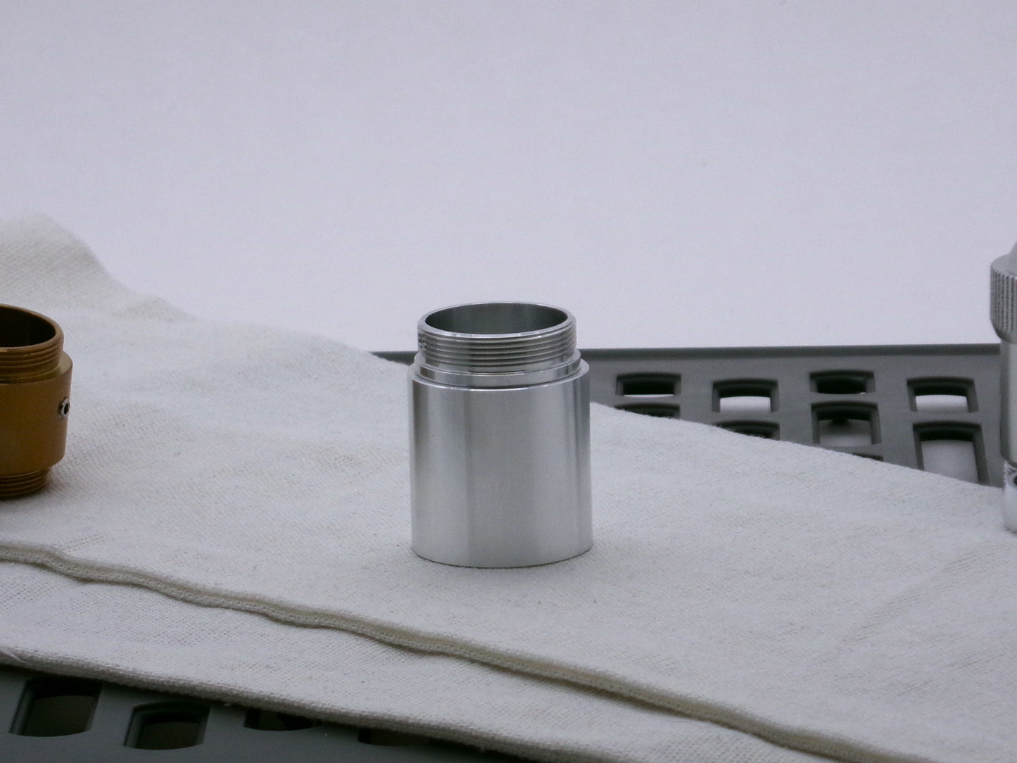 Single, aluminum male/male threaded adapter for VHC lightsabers installed in a Type_2 Body Component; 30mm diameter.