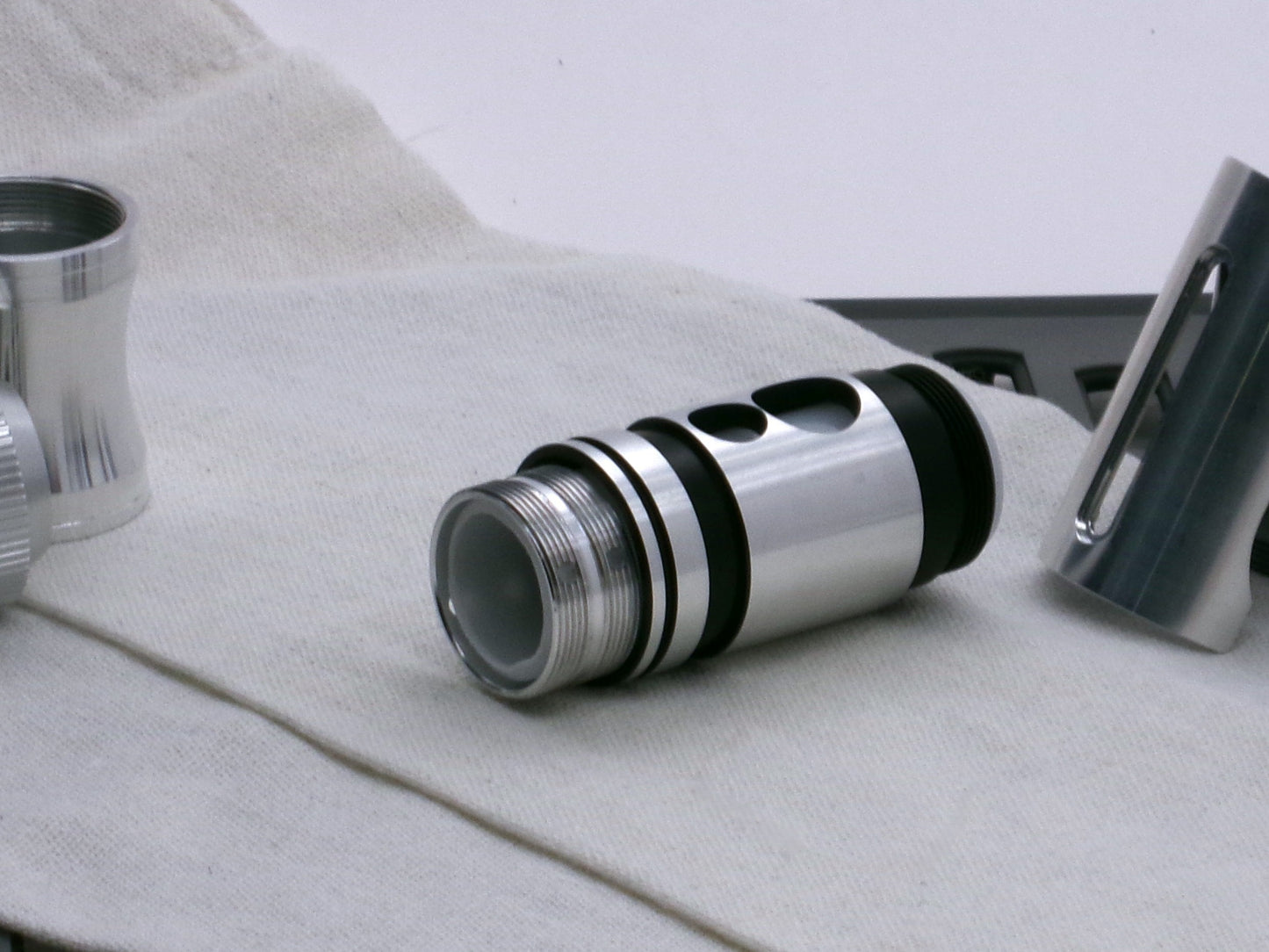 A stealthy, no-show, aluminum male-to-male formatted adapter that hides between female formatted parts in 3/4 view with switch prior to install.