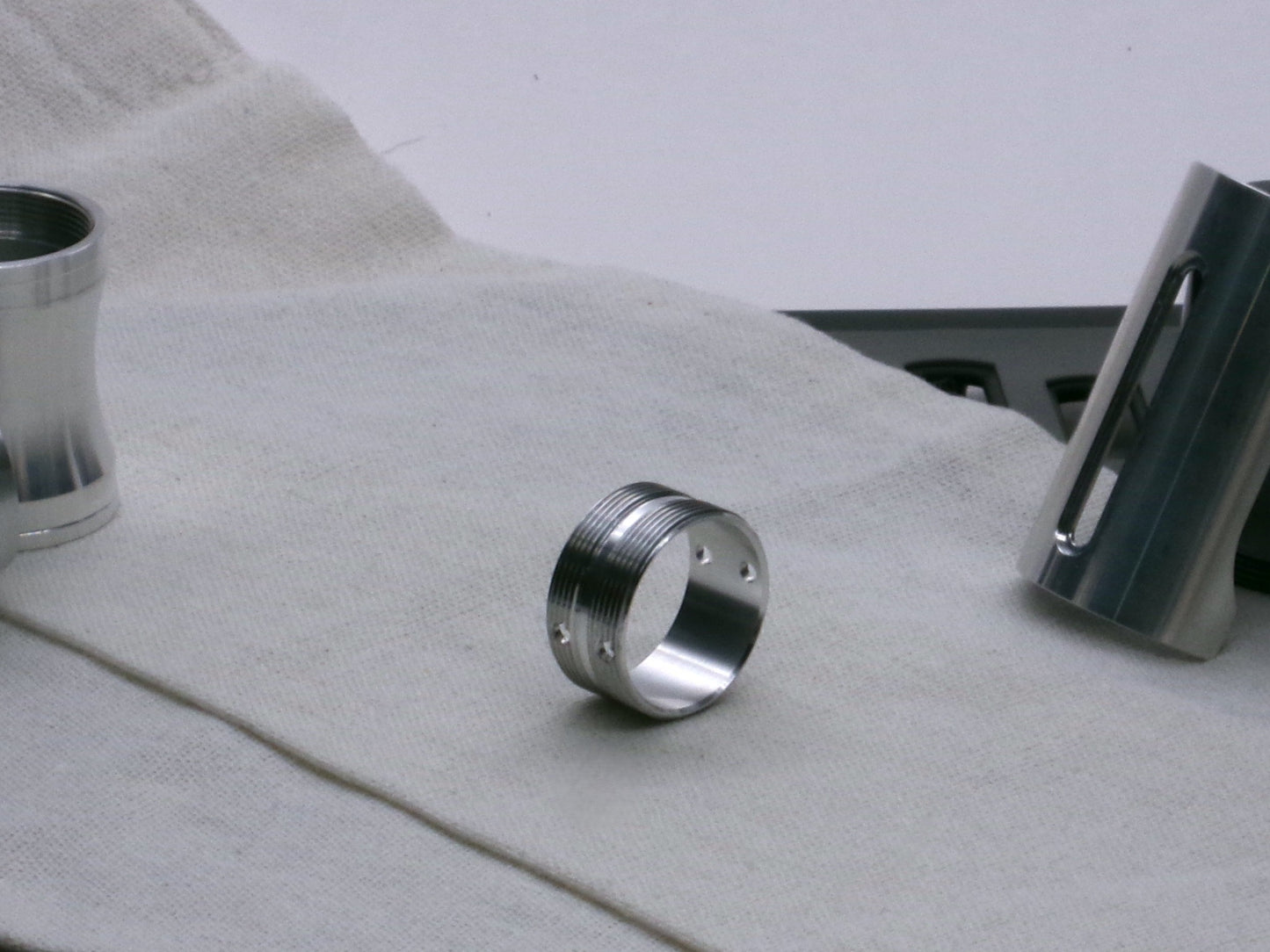 A stealthy, no-show, aluminum male-to-male formatted adapter that hides between female formatted parts in 3/4 view.
