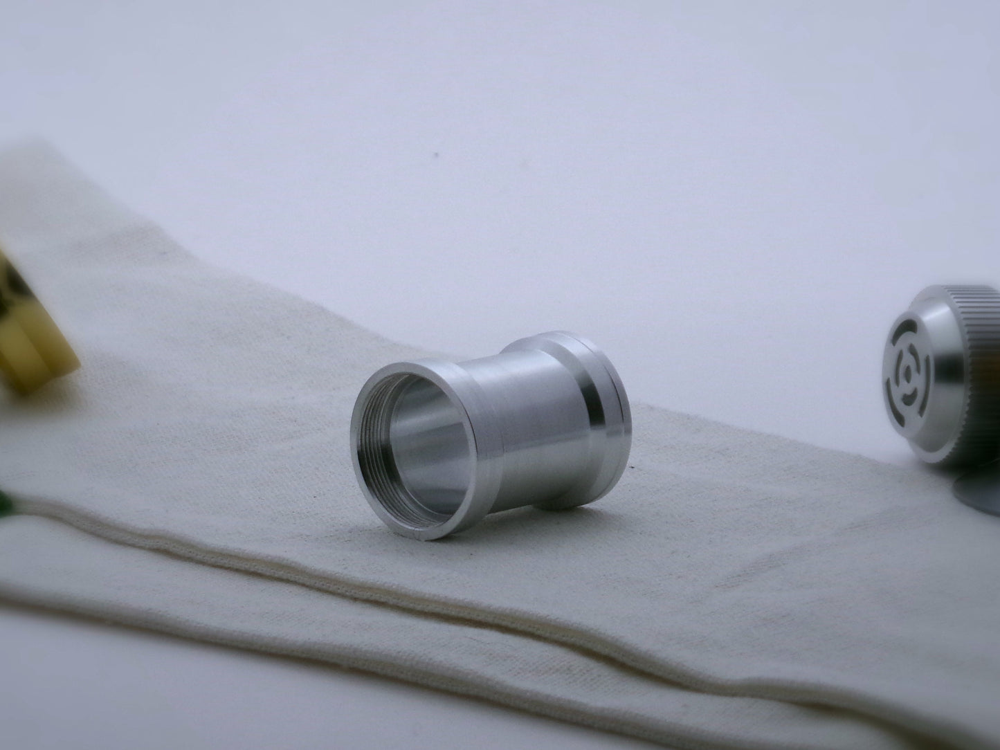 Aluminum female/female threaded angular grip choke for VHC lightsabers; three-quarter view.