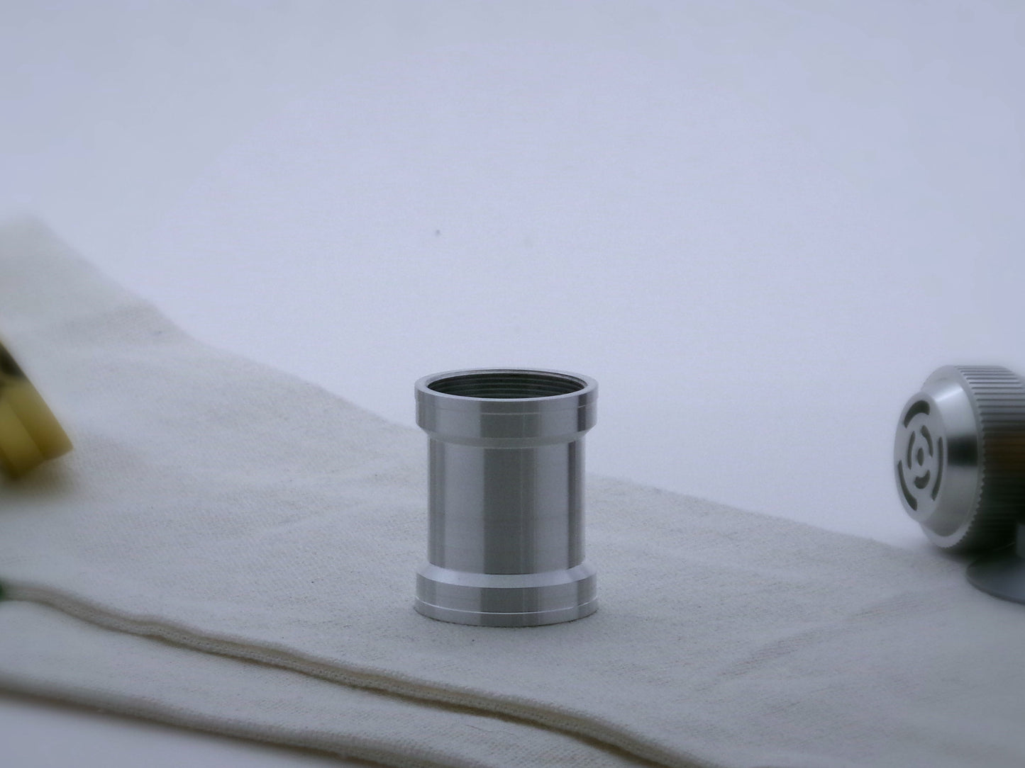 Aluminum female/female threaded angular grip choke for VHC lightsabers; standing proud.