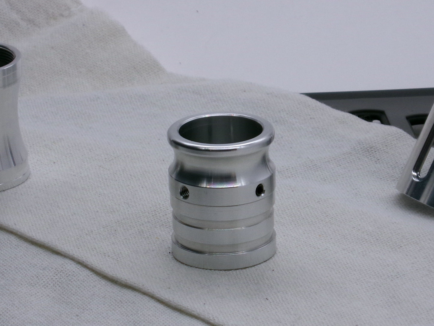 An emitter tip installed on a FF Extension Type 1, standing proud on a coarse cloth.