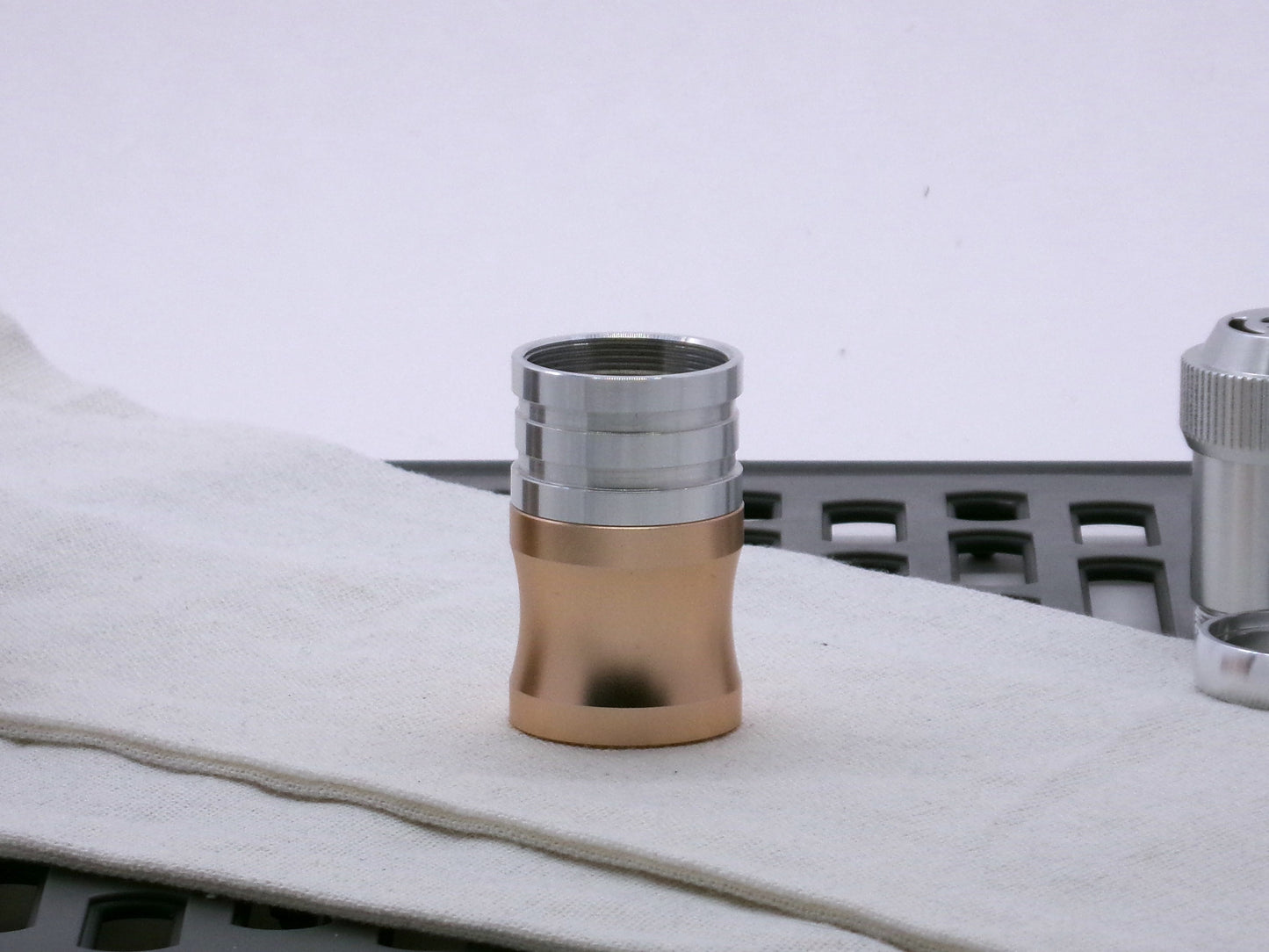 Aluminum female/female threaded ribbed extension for VHC lightsabers installed atop a VHC Choke.