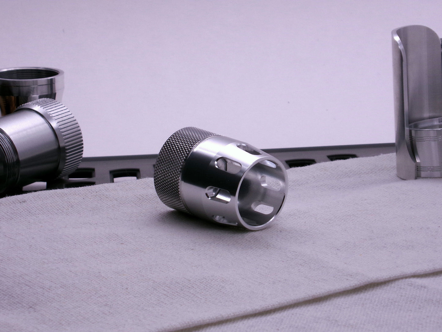 VHC compatible knurled body segment connected to an emitter tip, 3/4 front view.