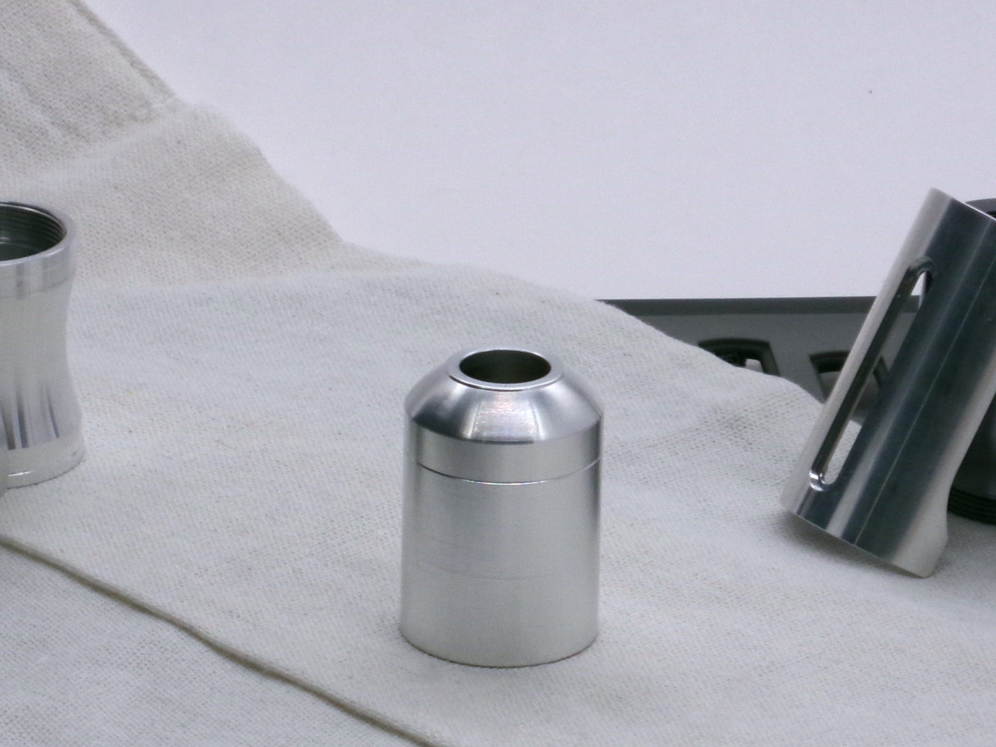 A basic, aluminum female-threaded pommel attached to a Body Segment Type 2 with a Adapter-MM-Type0.