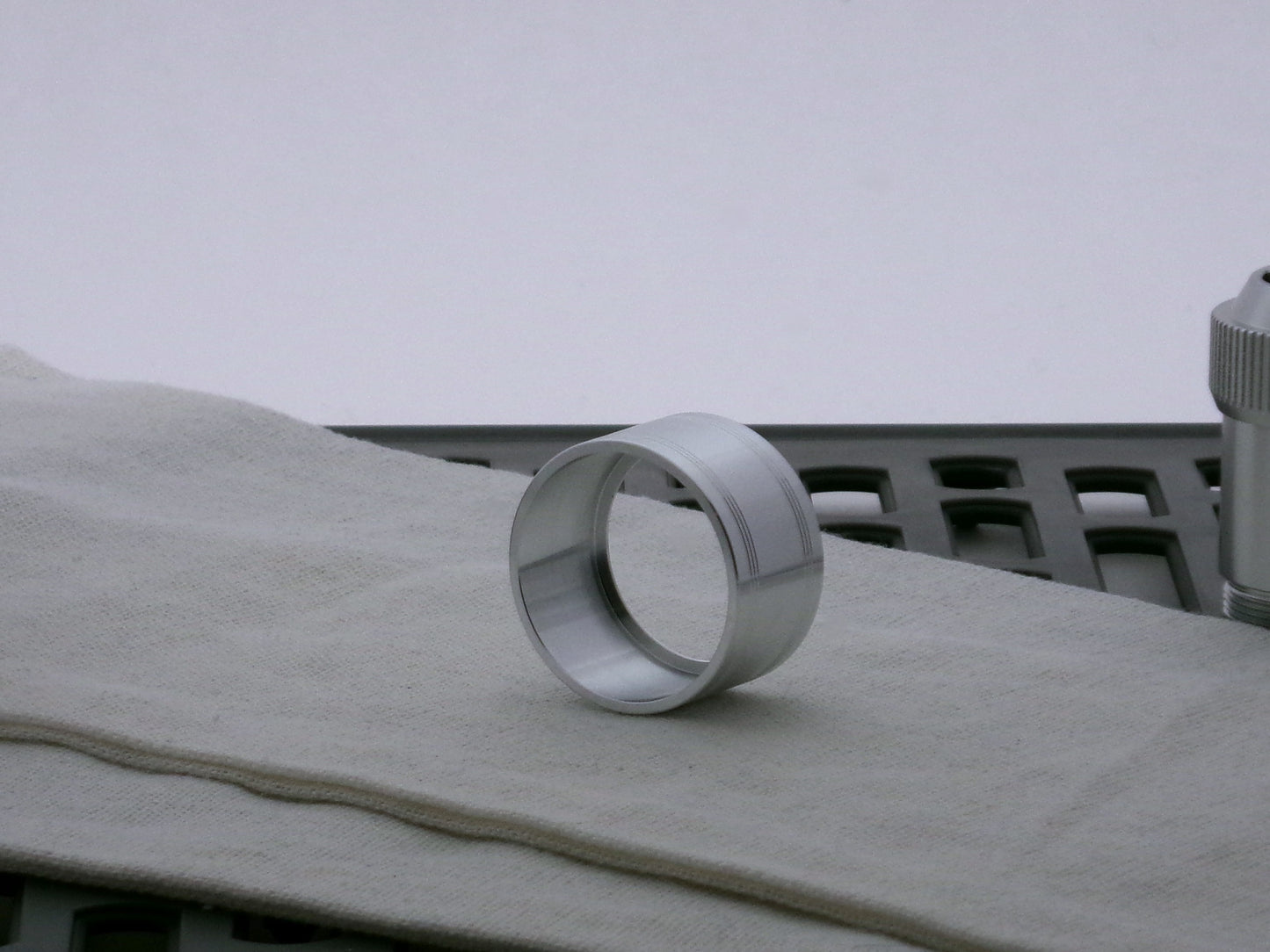 Single aluminum accent cap for VHC lightsabers, three-quarter view showing inner detail and shimsert.