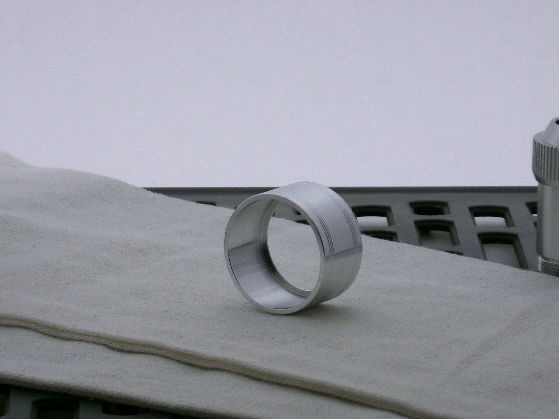 Single aluminum accent cap for VHC lightsabers, three-quarter view showing inner detail and shimsert.