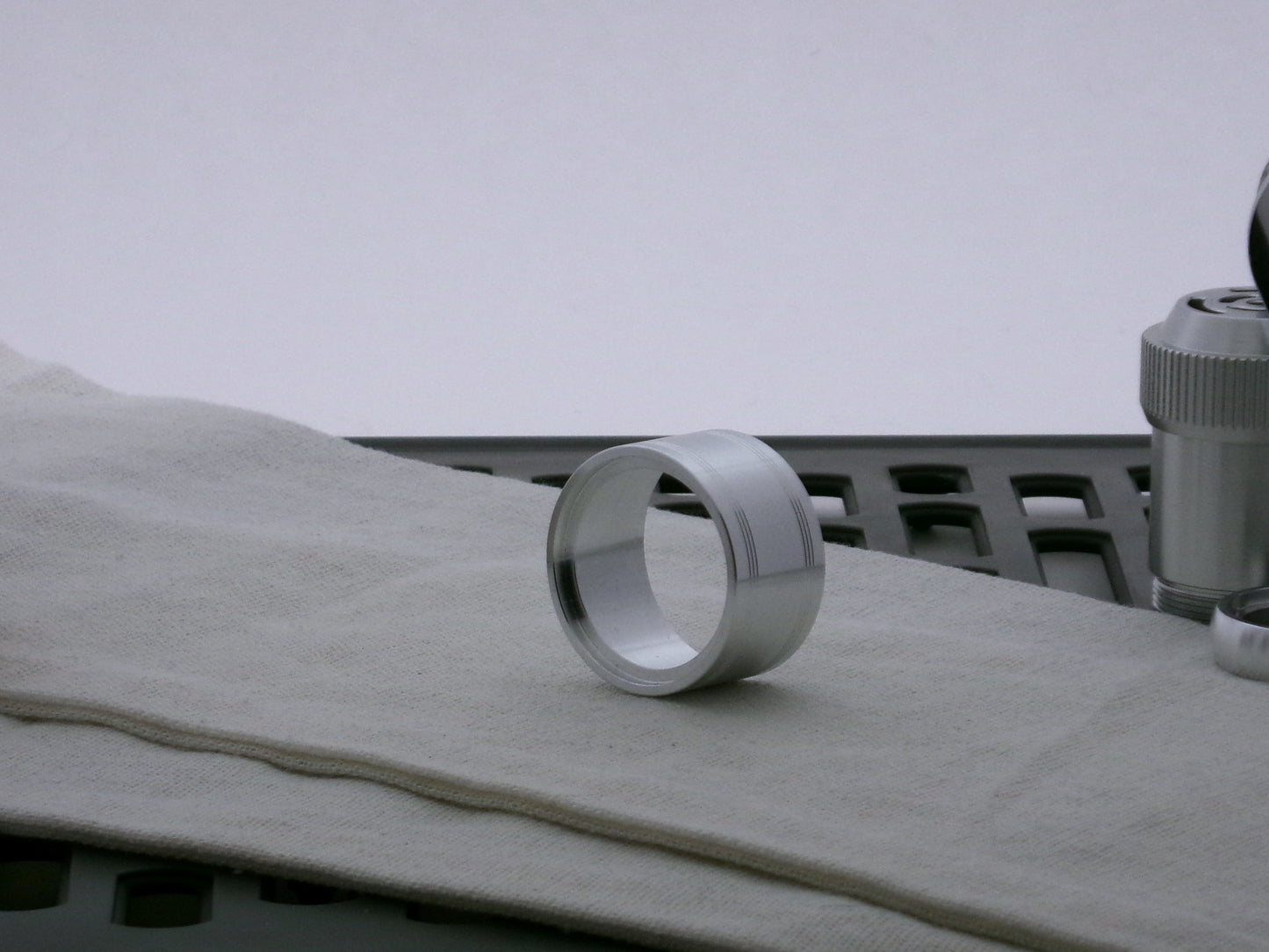 Single aluminum accent cap for use on VHC lightsabers, three-quarter view showing detail of shimsert depth.