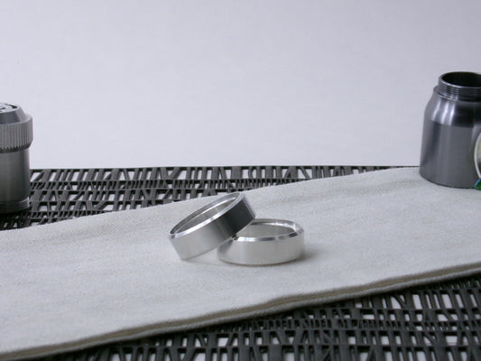 A pair of VHC-compatible Accent Bands sit askew on a cloth.