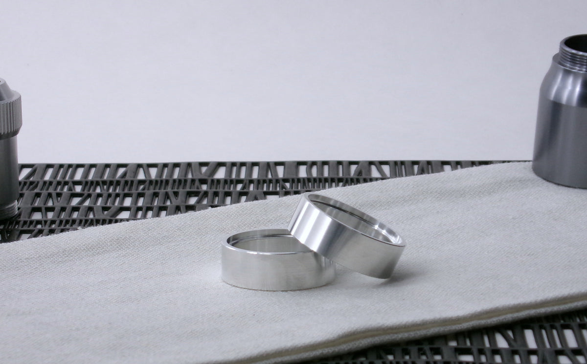 Pair of VHC-compatible Accent Band Type_3's, askew on a canvas cloth.