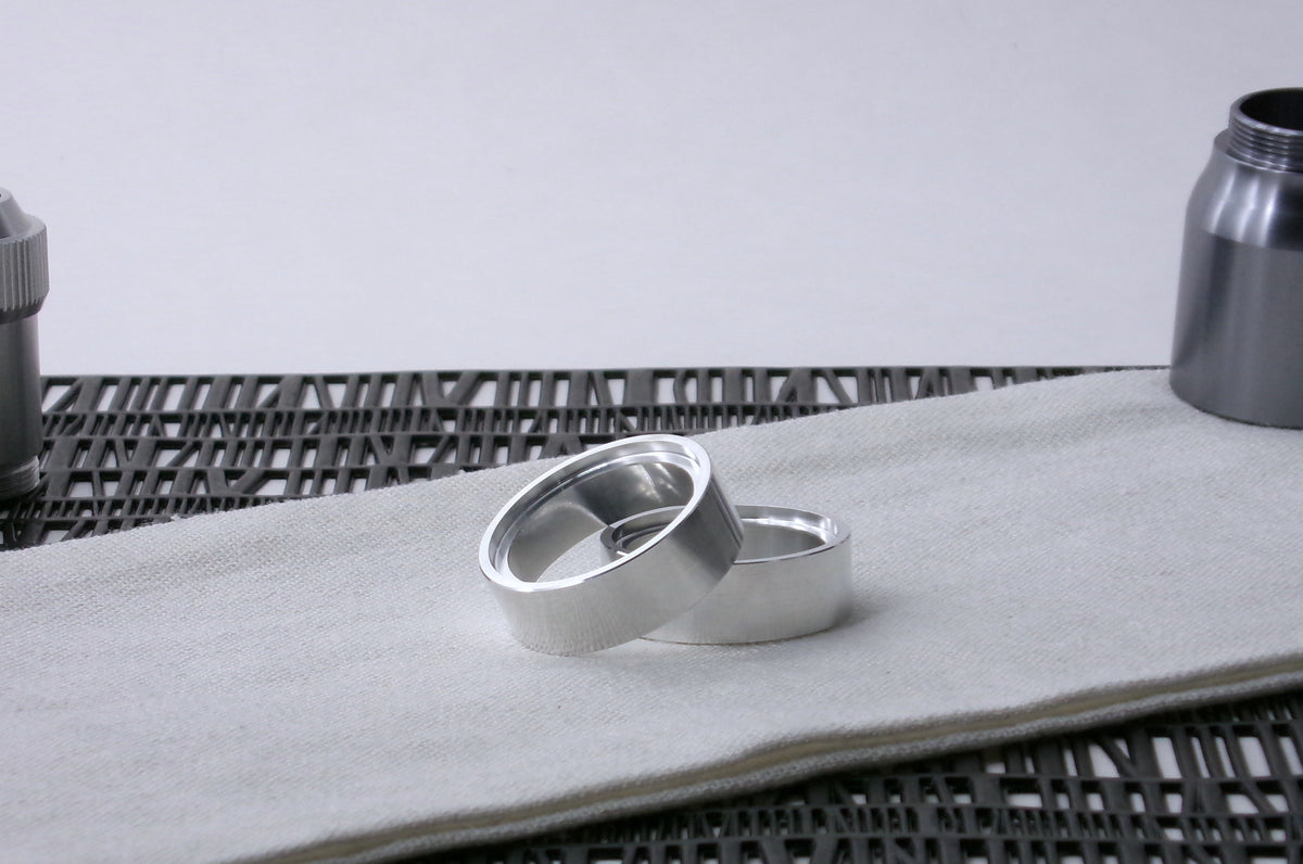 Pair of VHC-compatible Accent Band Type_3's, askew on a canvas cloth.