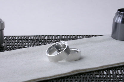 Pair of VHC-compatible Accent Band Type_3's, askew on a canvas cloth.