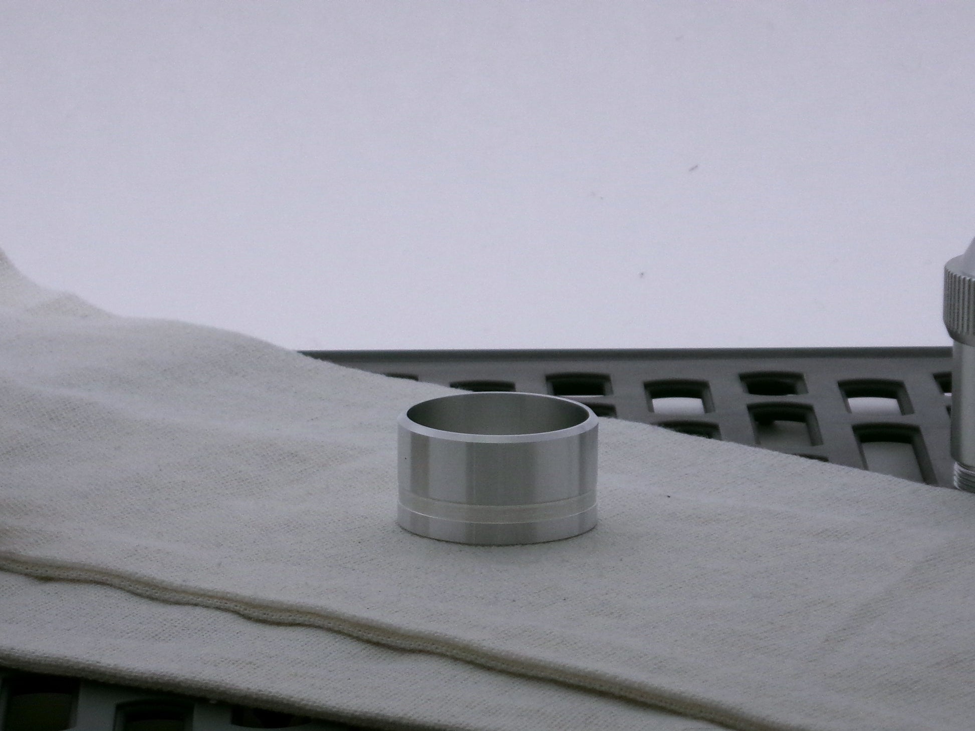 Single aluminum accent cap for VHC lightsabers, beveled edge facing upward, with one debossed groove. 