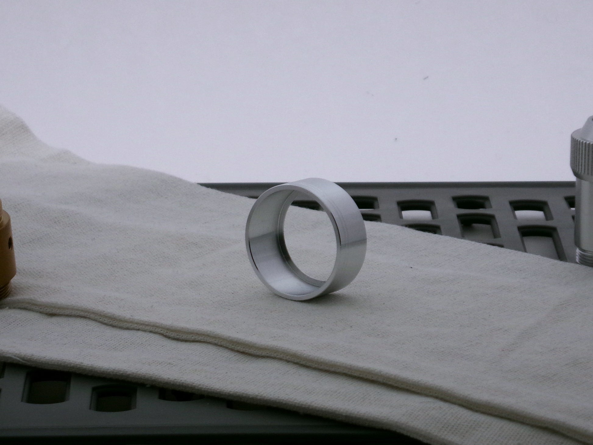 Single aluminum accent cap for VHC lightsabers, three-quarter view showing inner detail and shimsert.