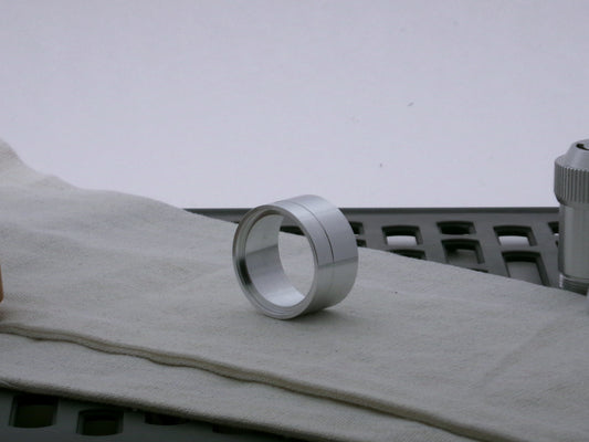Single aluminum accent cap designed for use on VHC lightsabers, three-quarter view showing detail of shimsert recess.