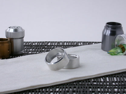 Pair of VHC-compatible, lightsaber Accent Caps, askew on a canvas cloth.