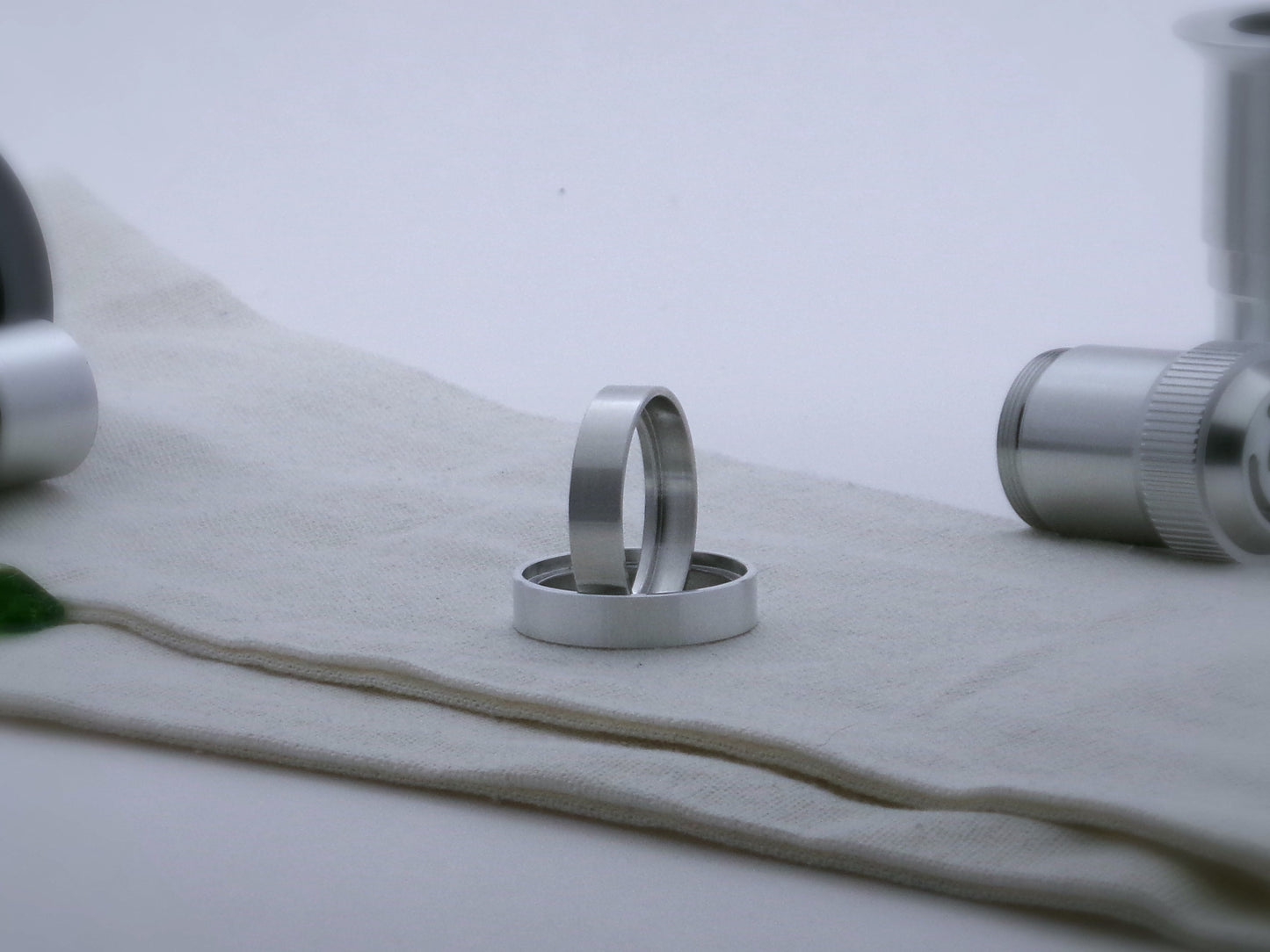 Pair of simple accent rings for VHC lightsabers, one standing vertically on edge inside the other.