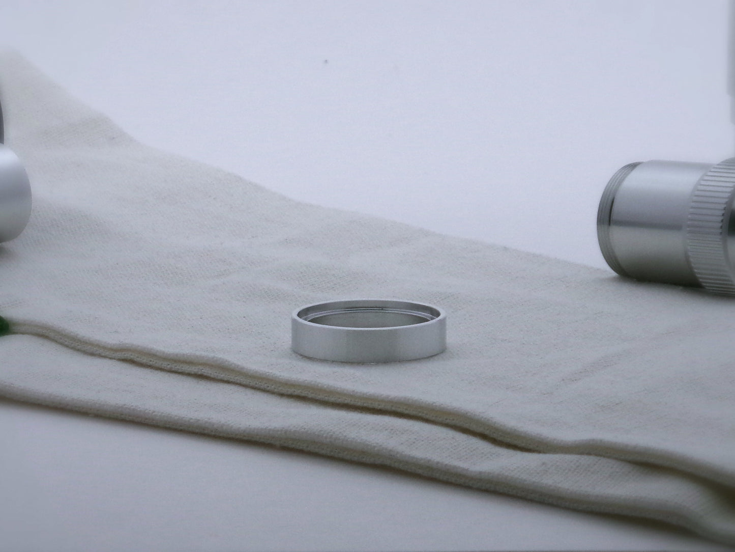 Single simple aluminum accent ring for VHC lightsabers, shimsert facing upward.