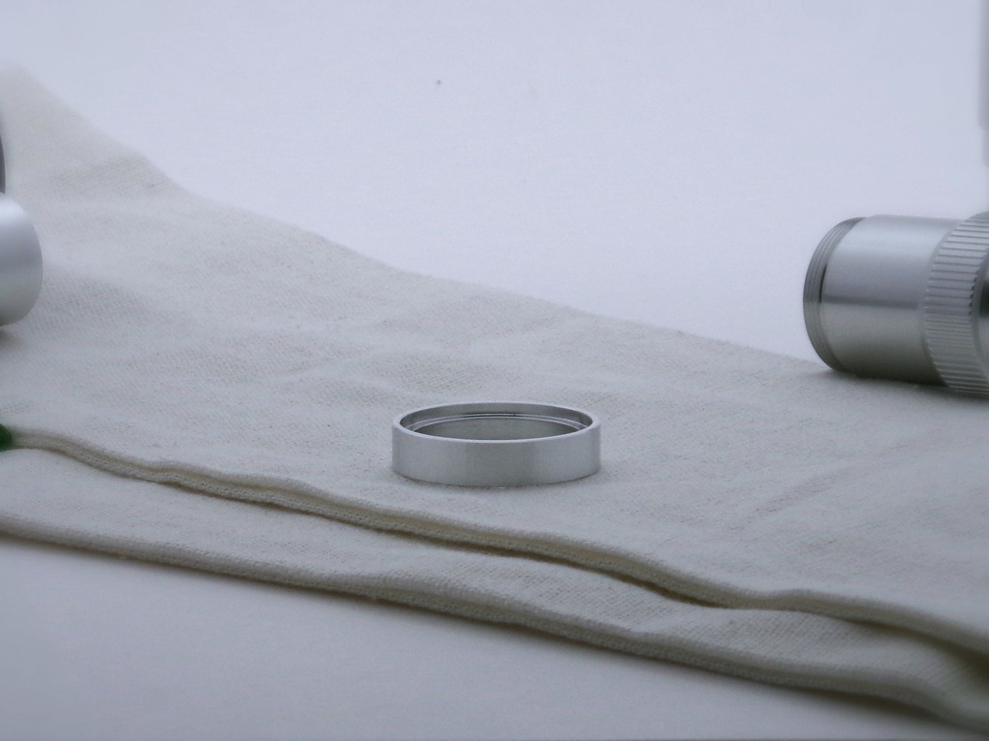 Single simple aluminum accent ring for VHC lightsabers, shimsert facing upward.