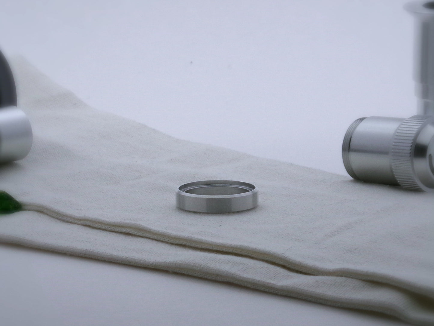 Single, simple, aluminum accent ring for VHC lightsabers, with beveled edges and shimsert facing upward.