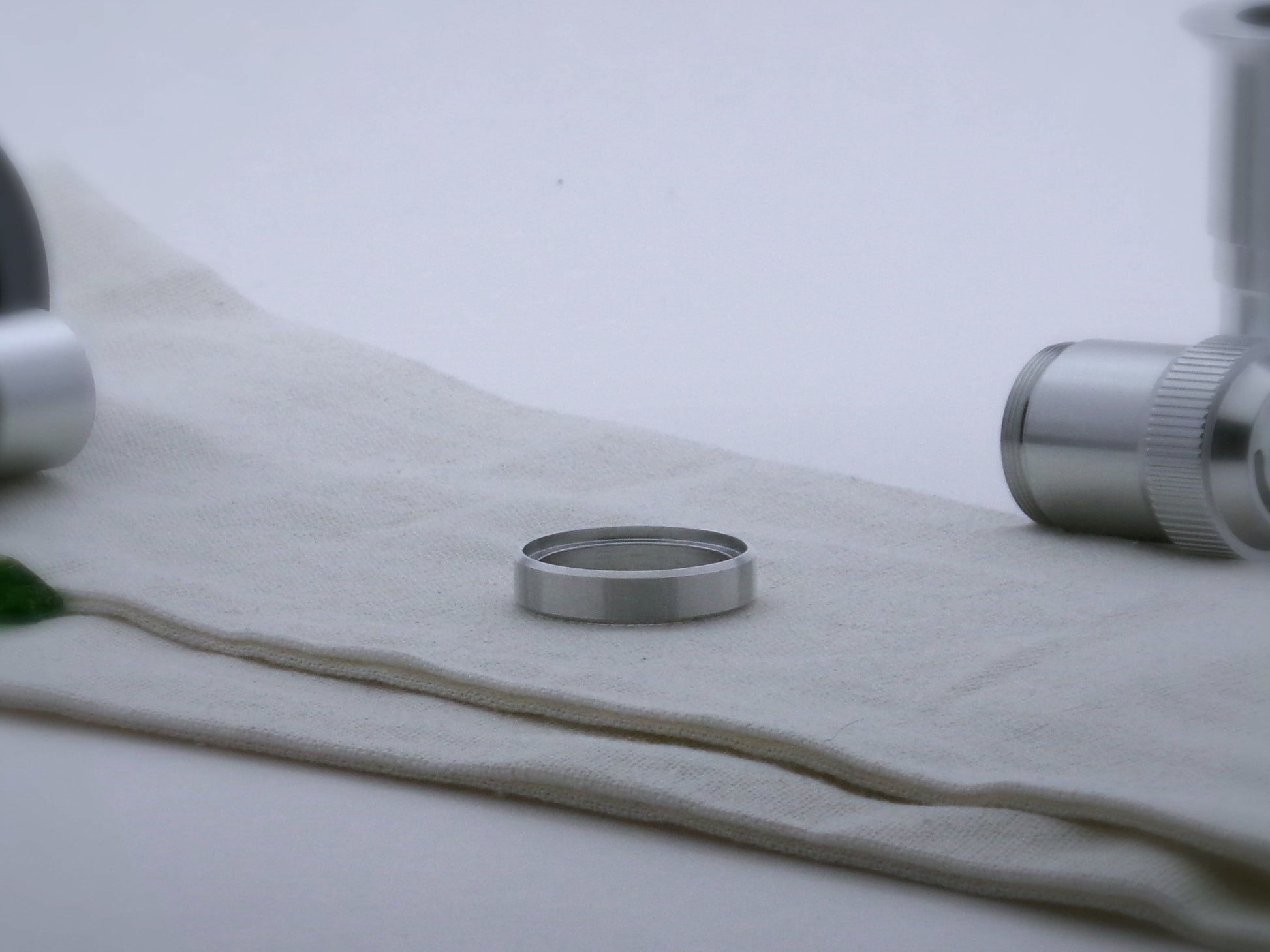 Single, simple, aluminum accent ring for VHC lightsabers, with beveled edges and shimsert facing upward.