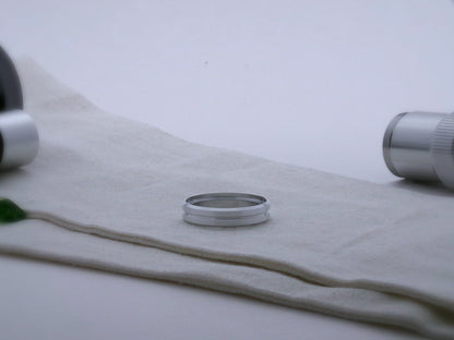 Single, aluminum accent ring for VHC lightsabers, with beveled edges and a central groove; shimsert facing upward.