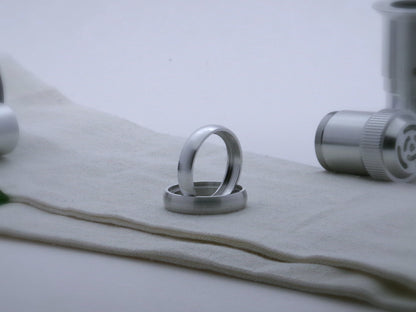Pair of rounded profile accent rings for VHC lightsabers, one standing vertically on edge inside the other.