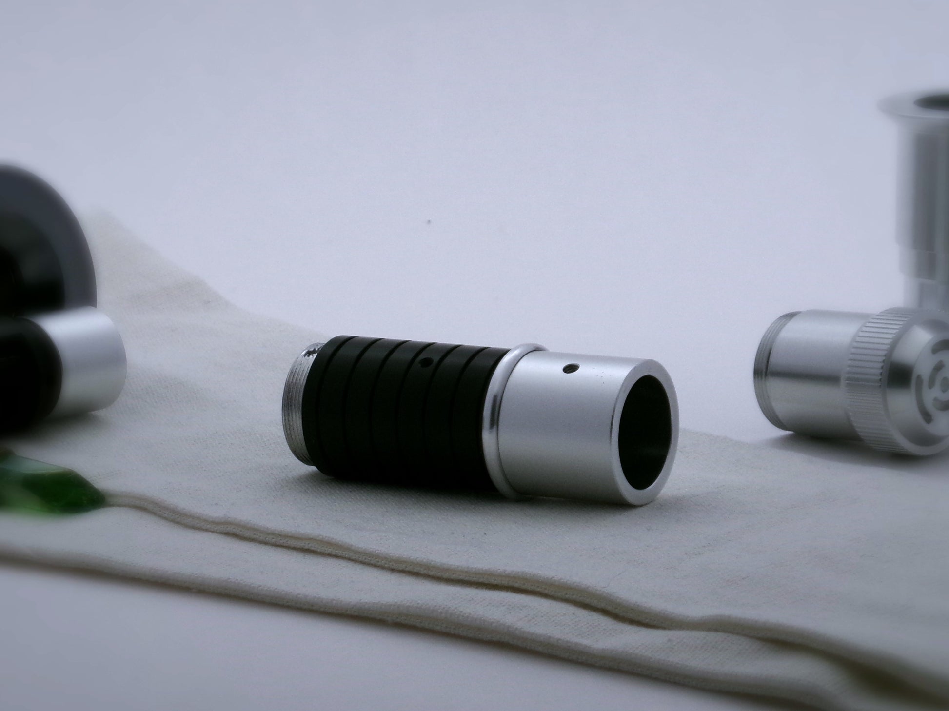 A single, round profile aluminum accent ring installed between mixed components.