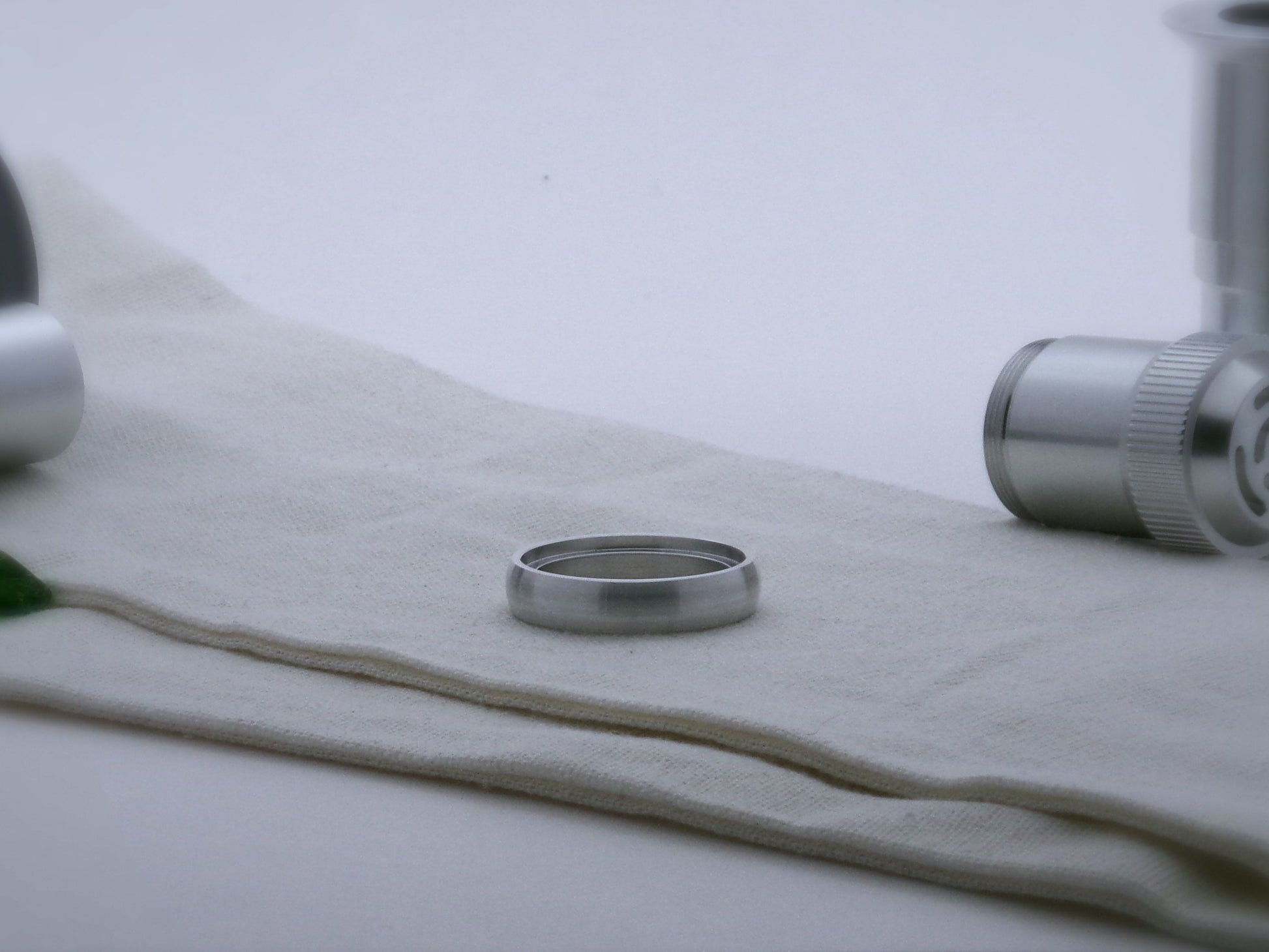 Single rounded profile aluminum accent ring for VHC lightsabers, shimsert facing upward.