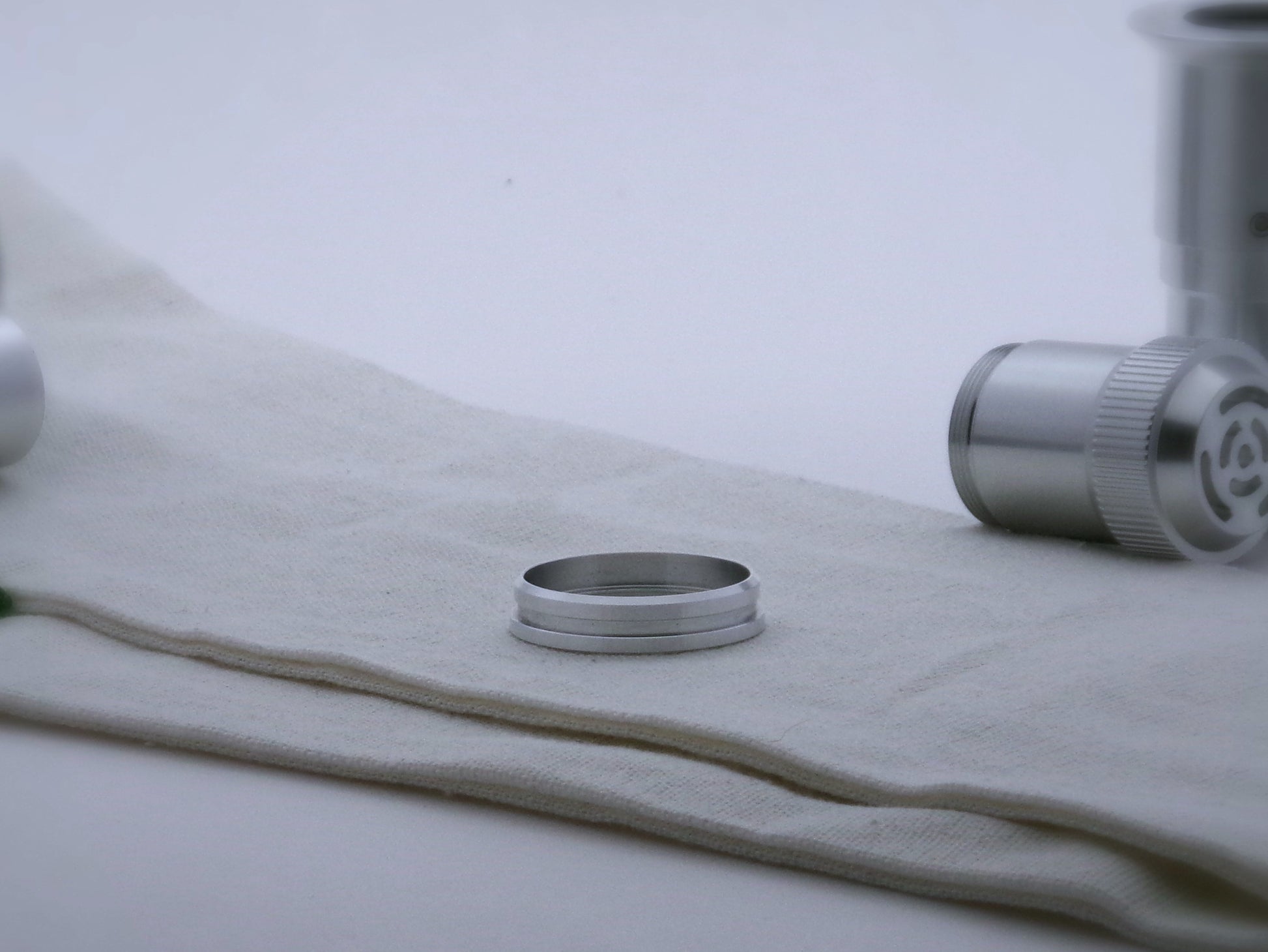 Single aluminum accent ring for VHC lightsabers with offset bands and a deep central groove, beveled lower edge facing upward.