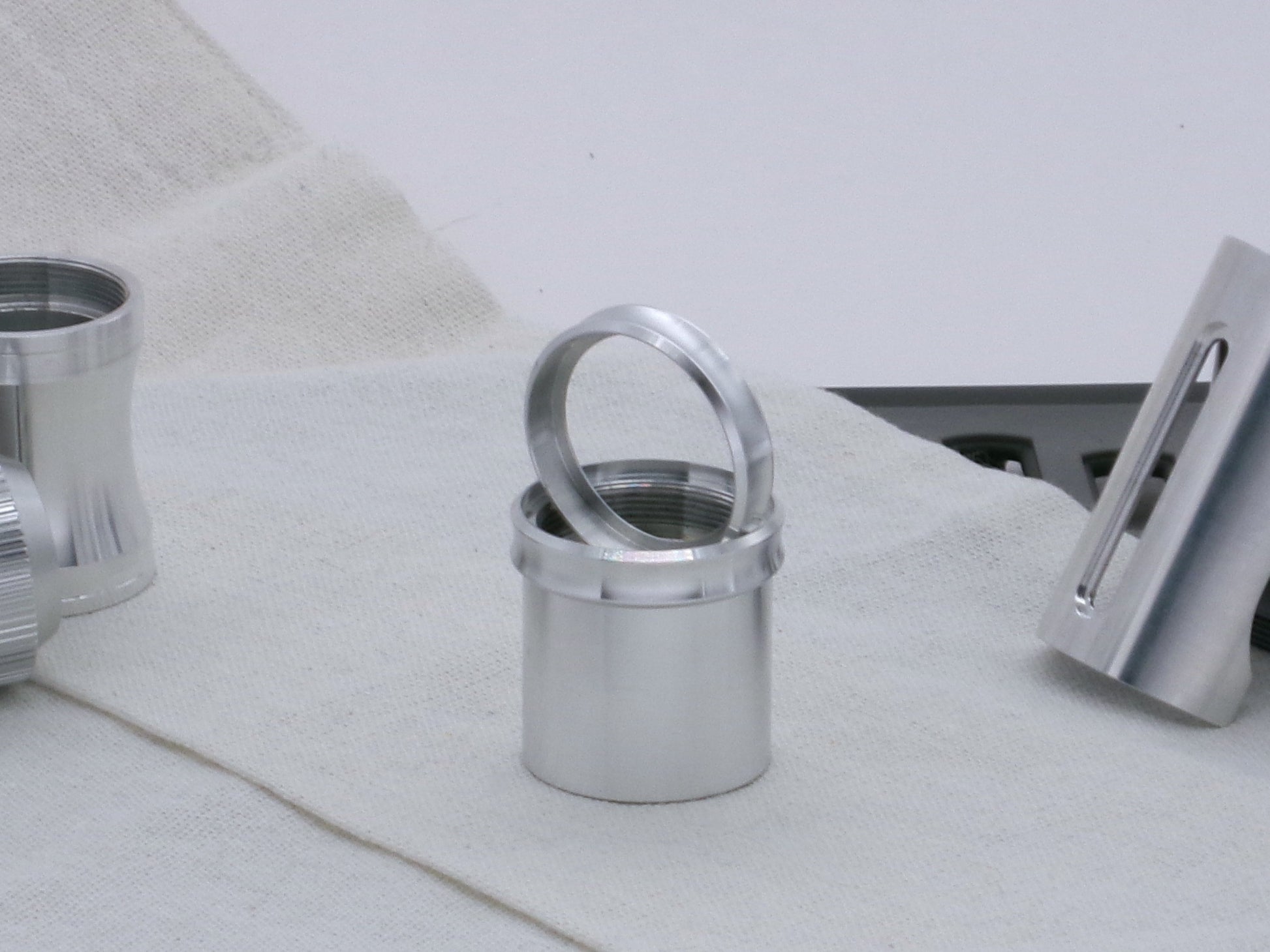 Pair of VHC compatible, aluminum lightsaber accent rings, installed and displayed on a lightsaber body segment.