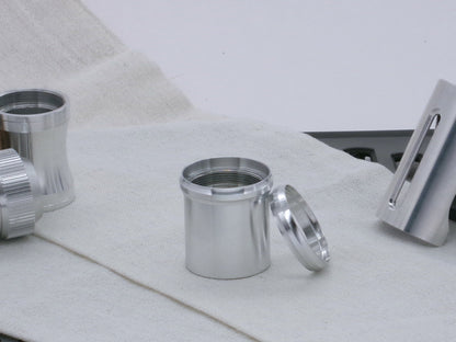 Pair of VHC compatible, aluminum lightsaber accent rings, one installed on a lightsaber body segment, the other askew.