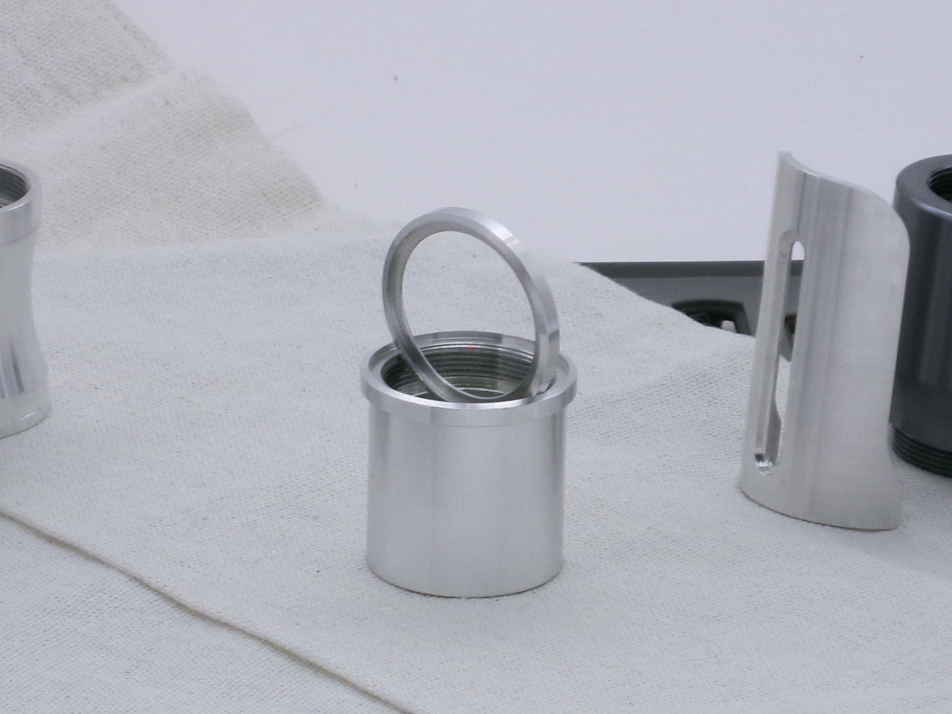 Pair of VHC compatible, aluminum lightsaber accent rings, one installed on a lightsaber body segment, the other displayed.
