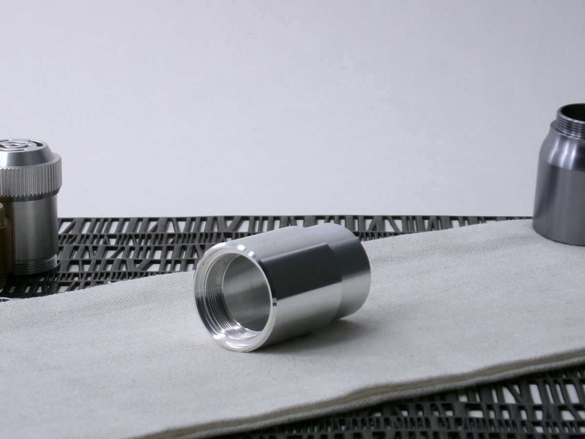 A beveled, VHC-compatible, lightsaber Accent Sleeve sits 3/4 view installed on a CSF Body Segment.