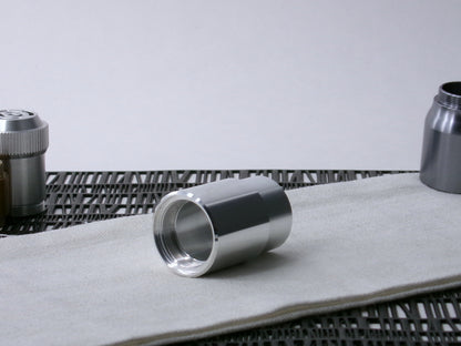 A beveled, VHC-compatible, lightsaber Accent Sleeve sits 3/4 view installed on a CSF Body Segment.