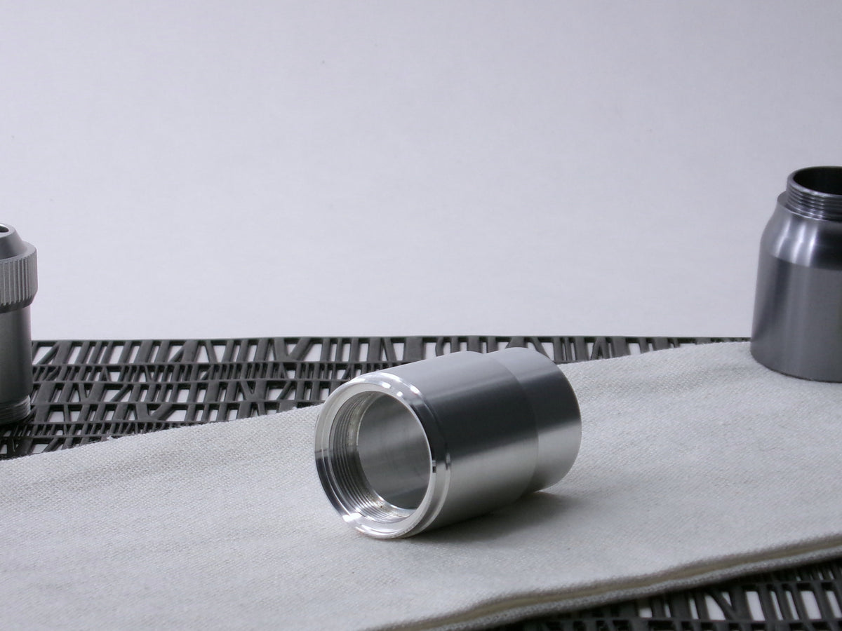 A stepped, VHC-compatible, lightsaber Accent Sleeve sits 3/4 view installed on a CSF Body Segment.