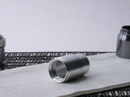 A stepped, VHC-compatible, lightsaber Accent Sleeve sits 3/4 view installed on a CSF Body Segment.