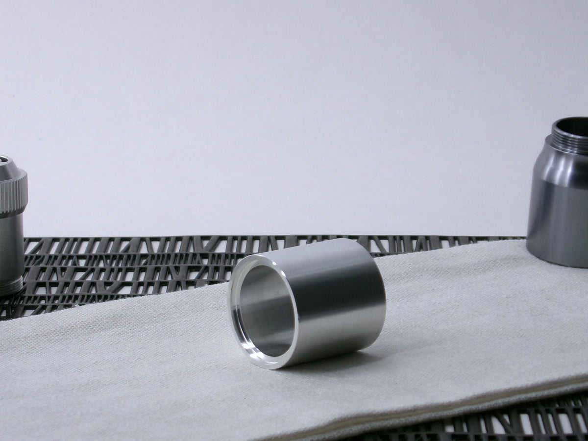 A plain, VHC-compatible Accent Sleeve sits 3/4 view, shimsert forward on a cloth.