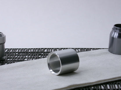 A plain, VHC-compatible Accent Sleeve sits 3/4 view, shimsert forward on a cloth.