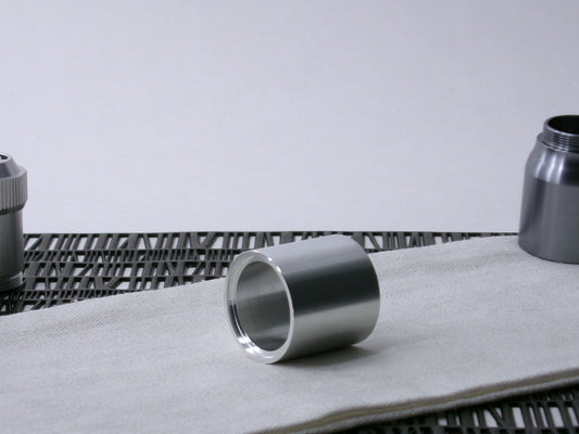 A plain, VHC-compatible Accent Sleeve sits 3/4 view, shimsert forward on a cloth.