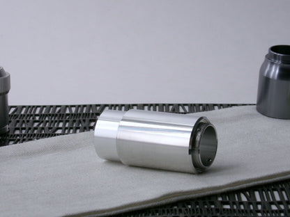 A beveled, VHC-compatible, lightsaber Accent Sleeve sits 3/4 view installed on a CSF Body Segment.